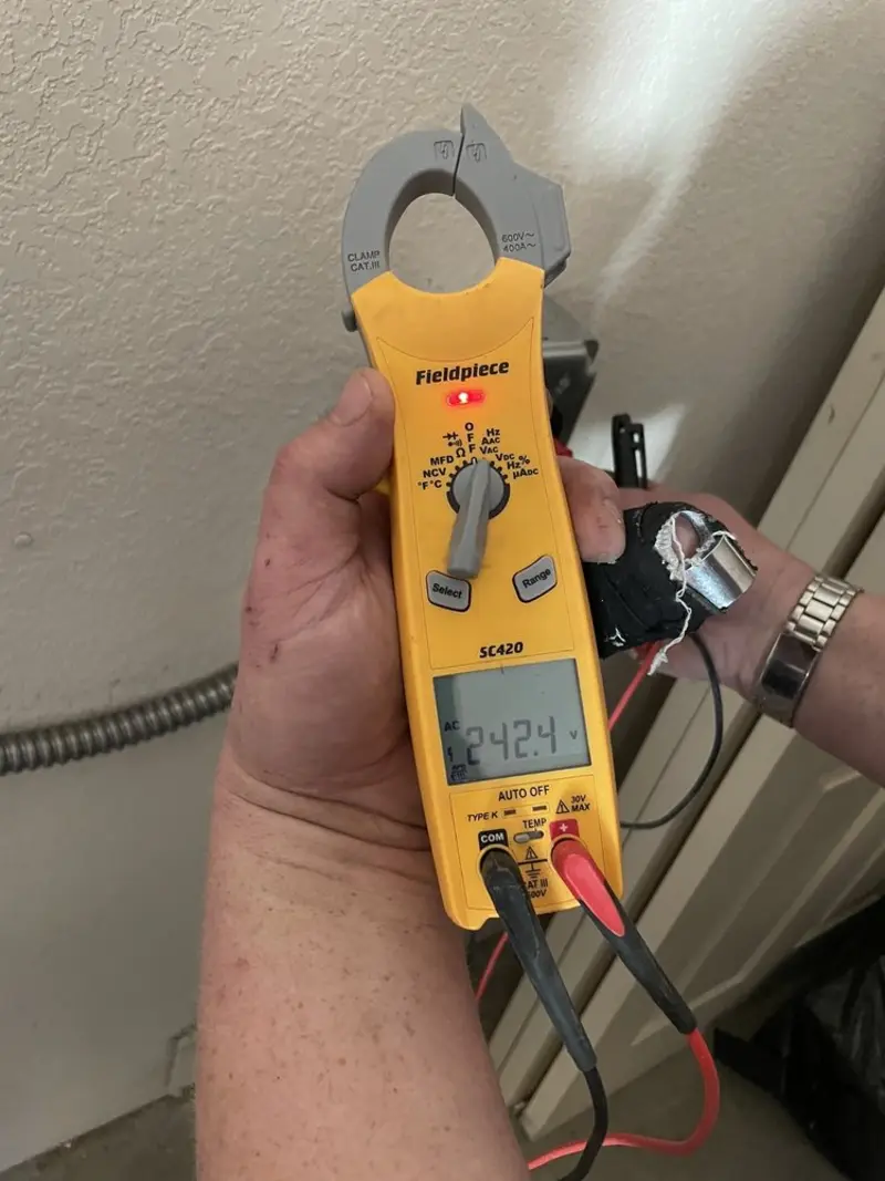 Voltage testing with clamp meter during Aluminum Wiring Replacement in Alden